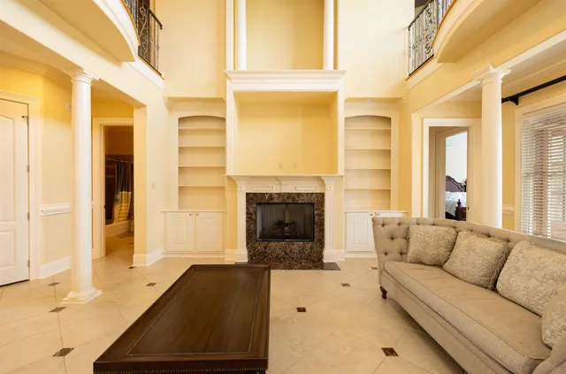 a living room with furniture and a fireplace