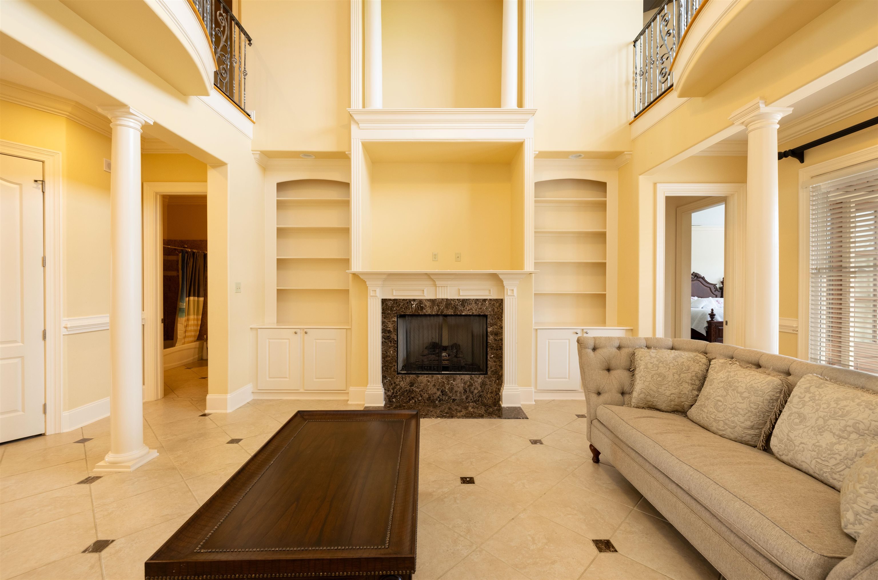 1042 Woodland Ridge Drive Cordova, TN 38018 - Photo 14 of 40 a living room with furniture and a fireplace