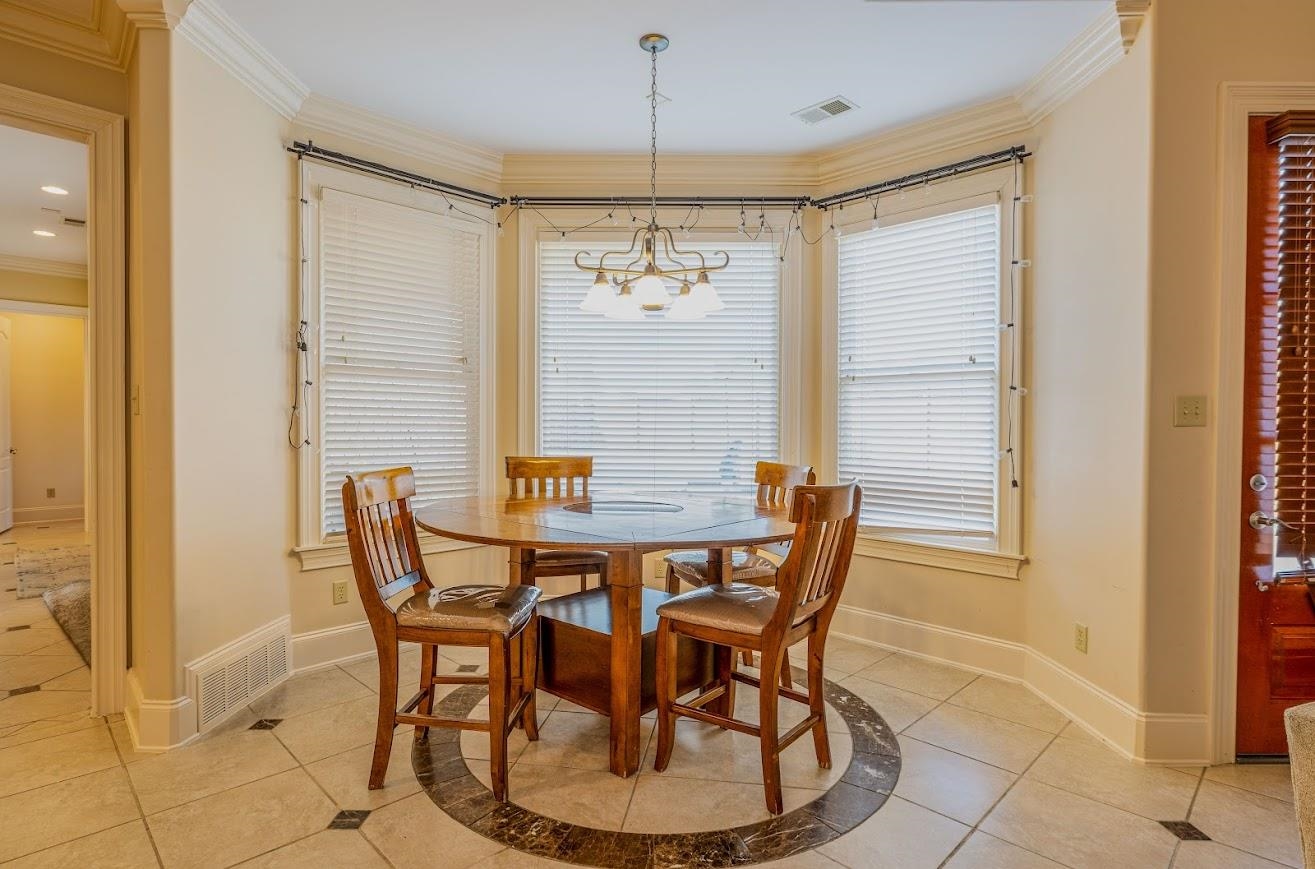 1042 Woodland Ridge Drive Cordova, TN 38018 - Photo 20 of 40 a view of a dining room with furniture and window