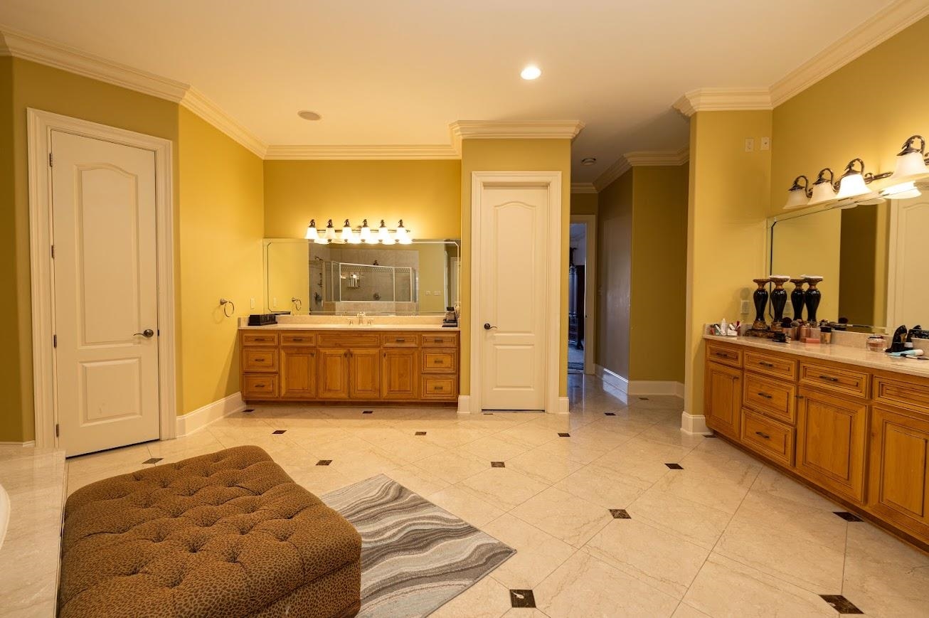 1042 Woodland Ridge Drive Cordova, TN 38018 - Photo 27 of 40 a bedroom with a bed and cabinets