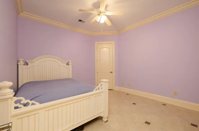 a bedroom with a bed and cabinets
