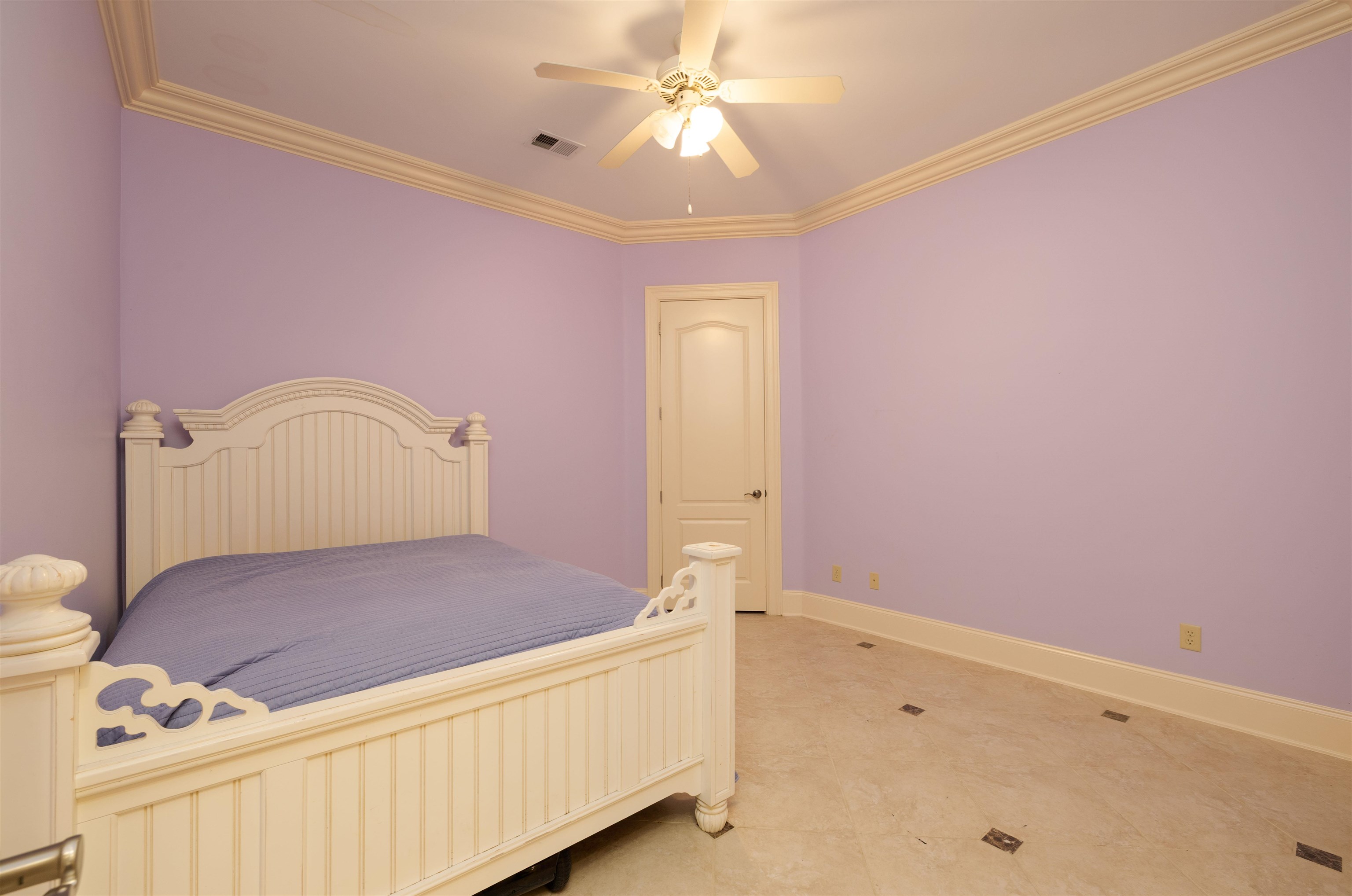 1042 Woodland Ridge Drive Cordova, TN 38018 - Photo 28 of 40 a bedroom with a bed and a chandelier