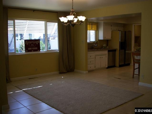 4931 Lakeridge Terrace West Reno, NV 89509 - Photo 4 of 9 a kitchen with a refrigerator and a stove