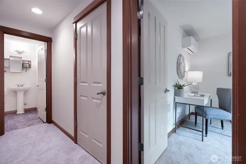 a view of a bathroom from a hallway