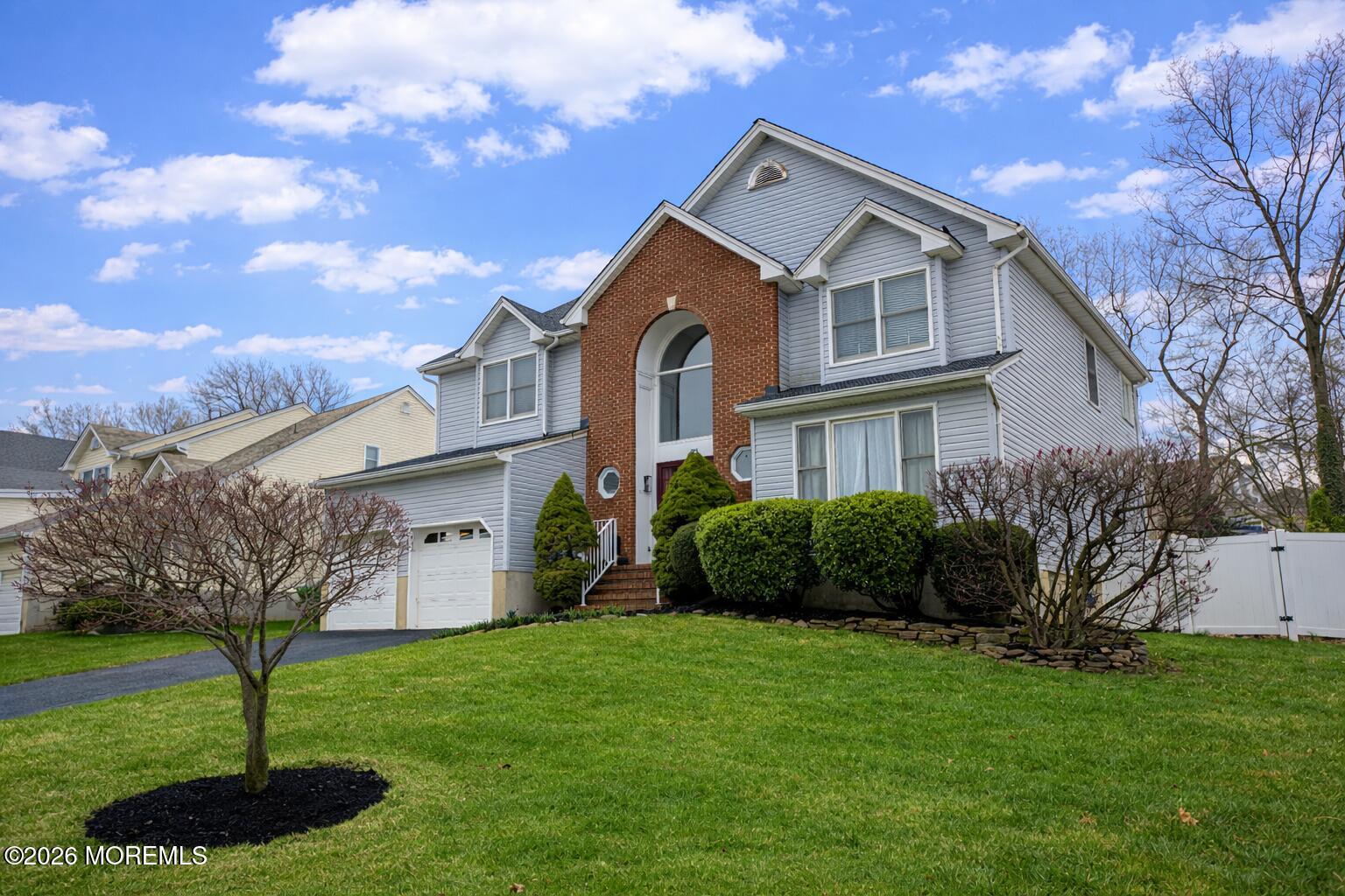 31 Scarlet Drive Parlin, NJ 08859 - Photo 3 of 67 a front view of a house with a garden