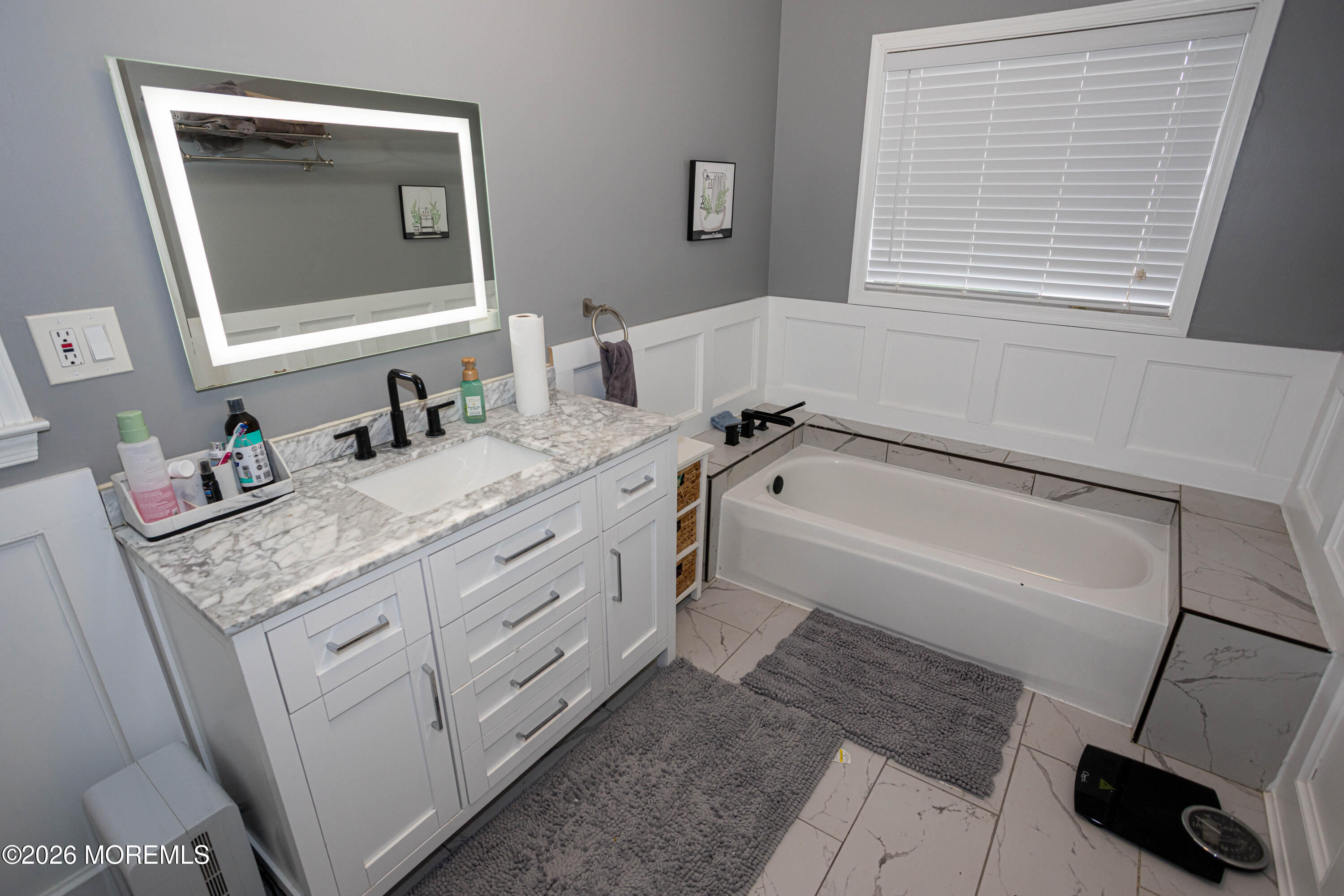 31 Scarlet Drive Parlin, NJ 08859 - Photo 38 of 67 a bathroom with a granite countertop sink a mirror and a bathtub