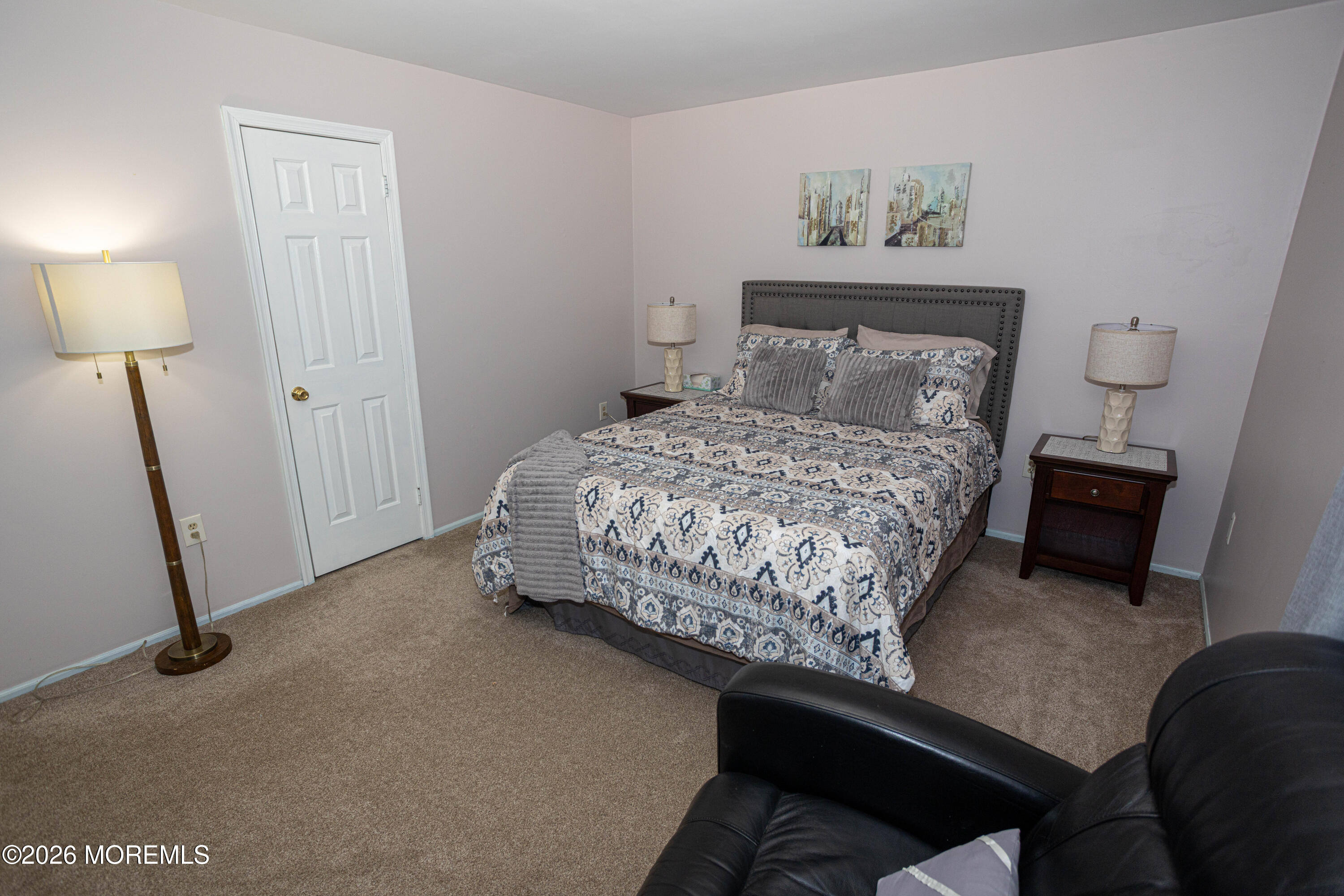 31 Scarlet Drive Parlin, NJ 08859 - Photo 43 of 67 a bed sitting in a bedroom next to a lamp
