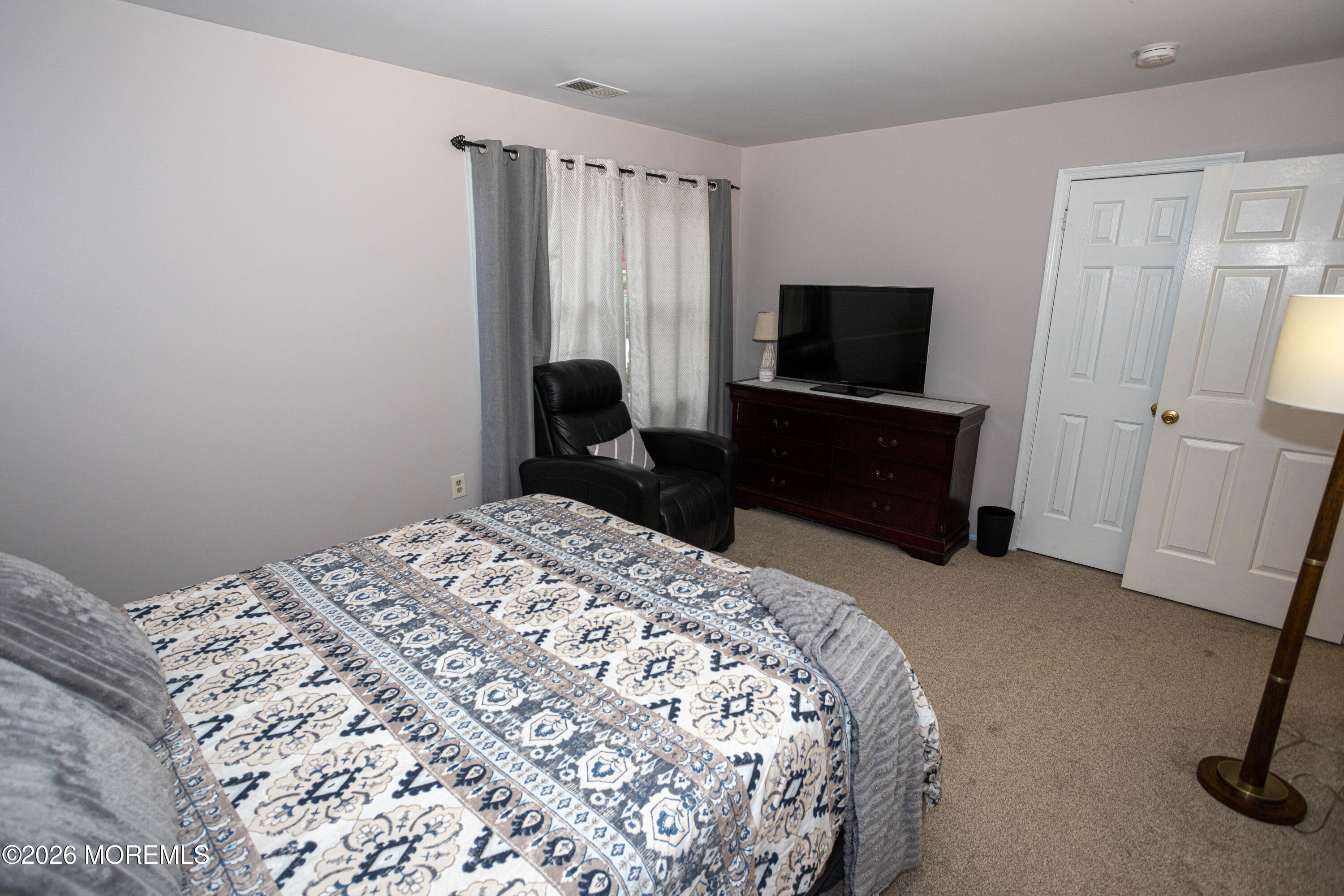 31 Scarlet Drive Parlin, NJ 08859 - Photo 44 of 67 a bedroom with a bed and a television in it