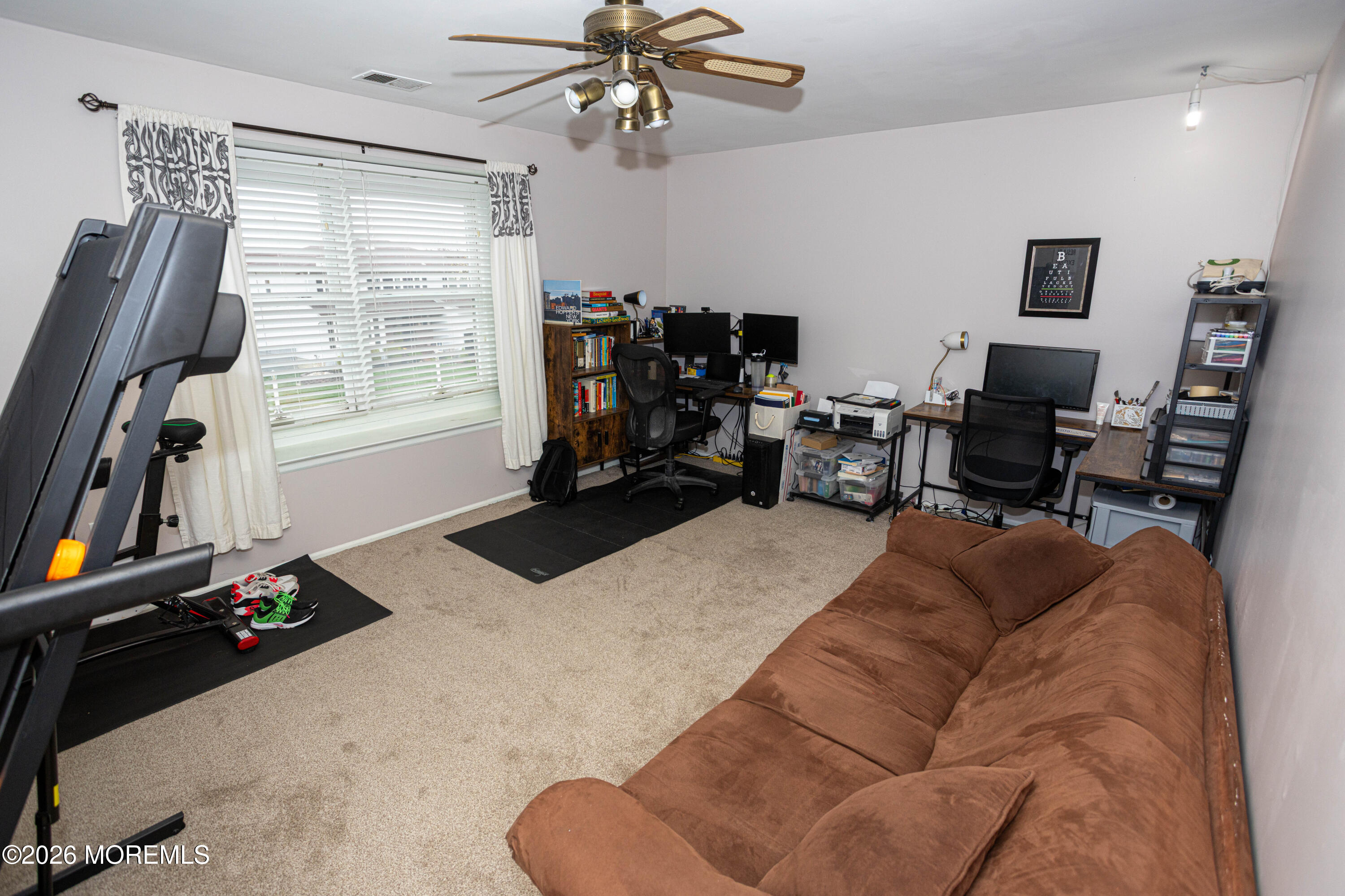 31 Scarlet Drive Parlin, NJ 08859 - Photo 48 of 67 a living room with furniture gym equipment and a window