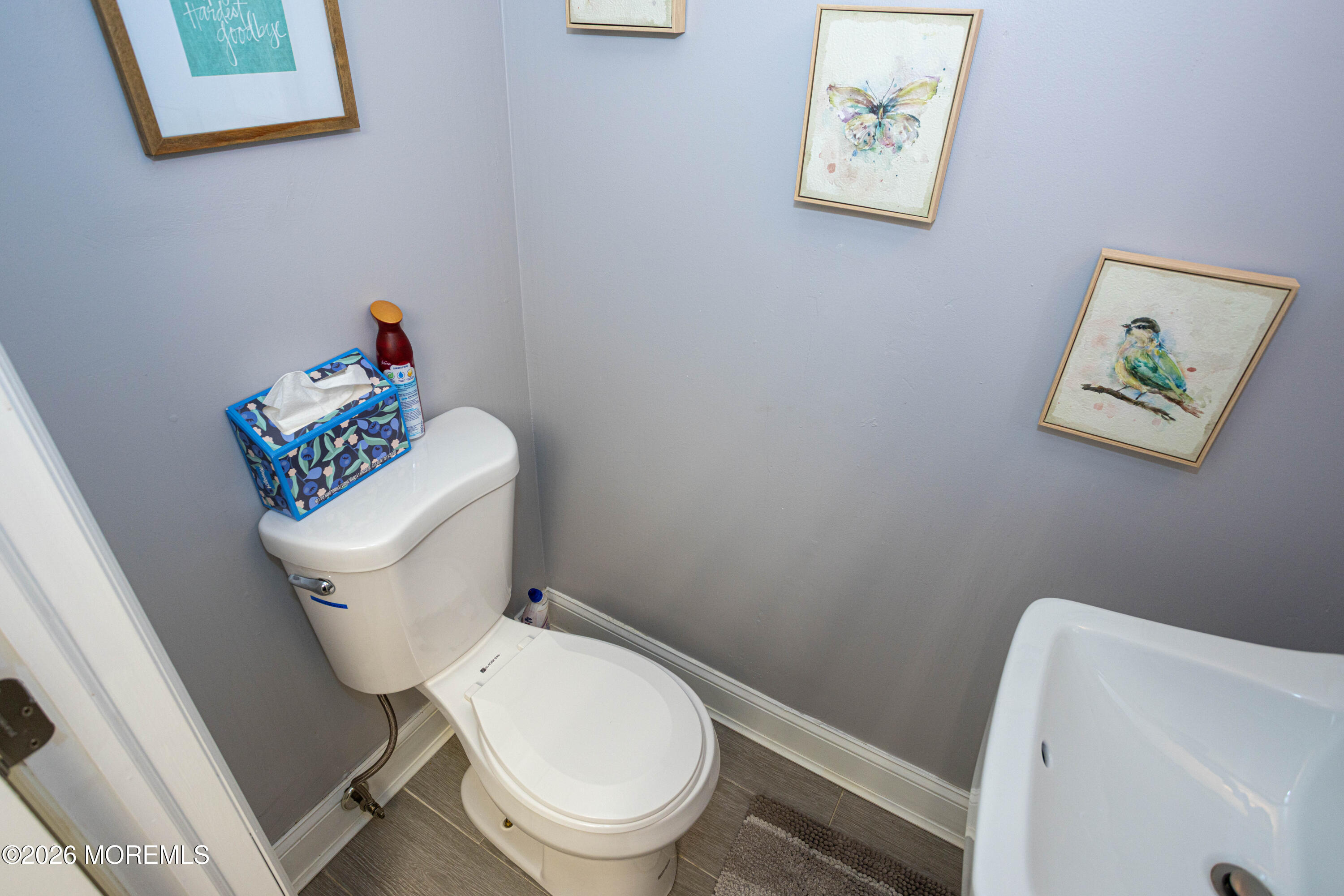 31 Scarlet Drive Parlin, NJ 08859 - Photo 56 of 67 a white toilet sitting next to a bathroom sink