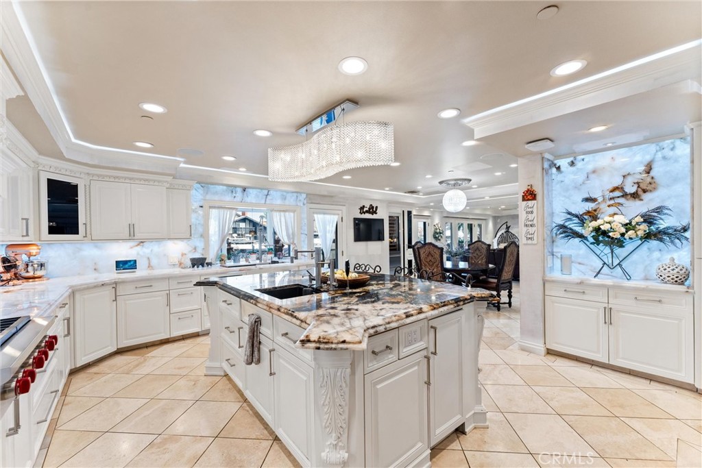 3781 Ragtime Circle Huntington Beach, CA 92649 - Photo 33 of 55 a kitchen with stainless steel appliances granite countertop a sink and cabinets
