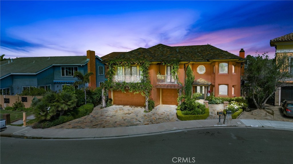 3781 Ragtime Circle Huntington Beach, CA 92649 - Photo 4 of 55 a front view of a house with a yard