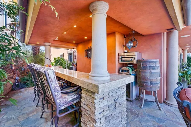 a wooden bench sitting in front of a house