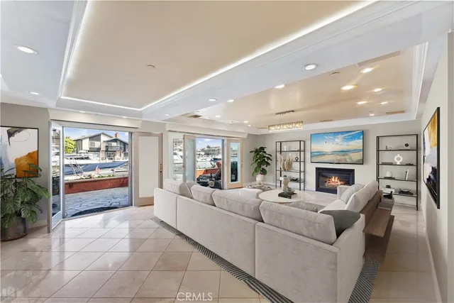 a bedroom with furniture and a large window