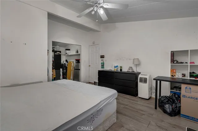 a bed room with a bed and a chandelier