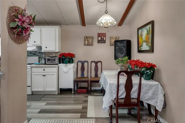 a dining room with furniture and window