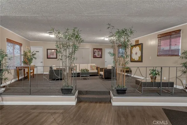 a lobby with furniture and chandelier
