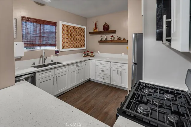 a kitchen with a sink stove and window