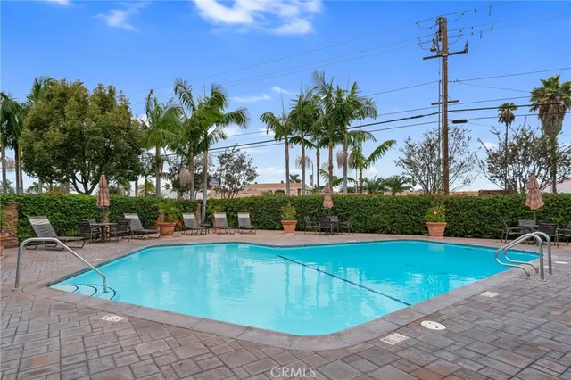 a view of a swimming pool with a patio