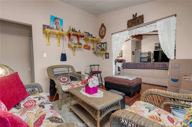 a living room with furniture and book shelf