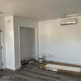 a view of a livingroom with wooden floor