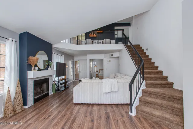 a living room with furniture and a fireplace