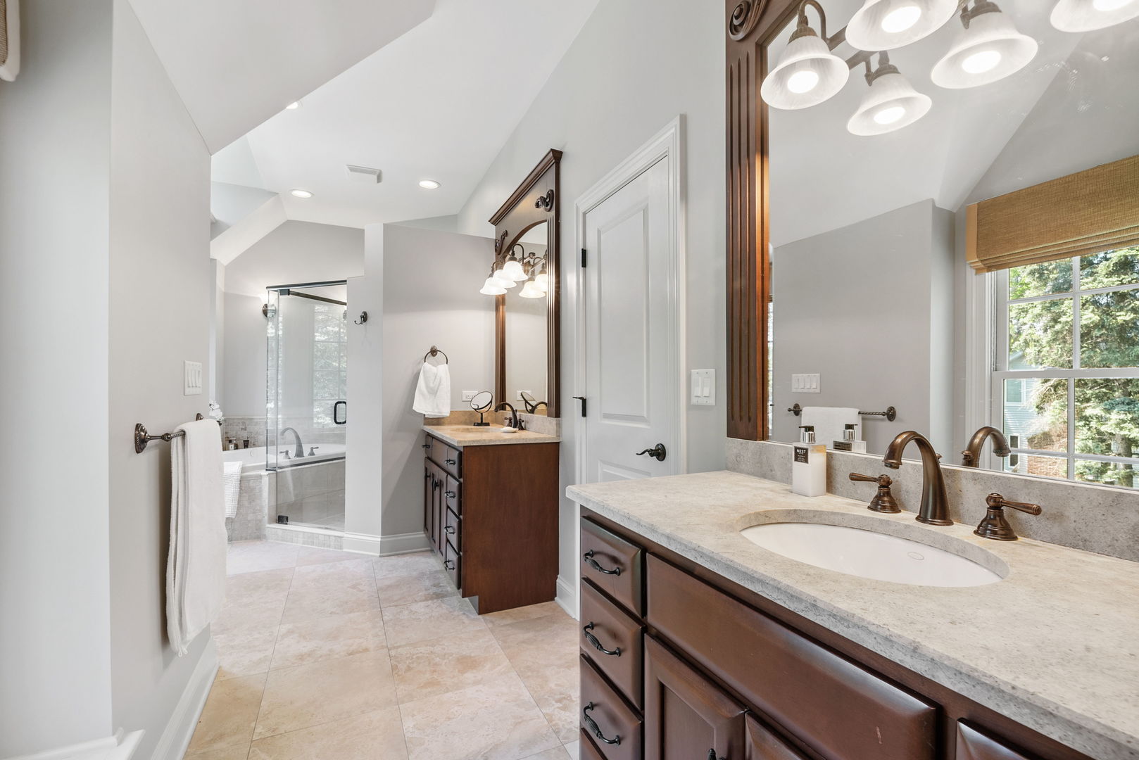 1209 Dunstan Road Geneva, IL 60134 - Photo 16 of 27 a bathroom with a granite countertop sink a toilet a mirror and shower
