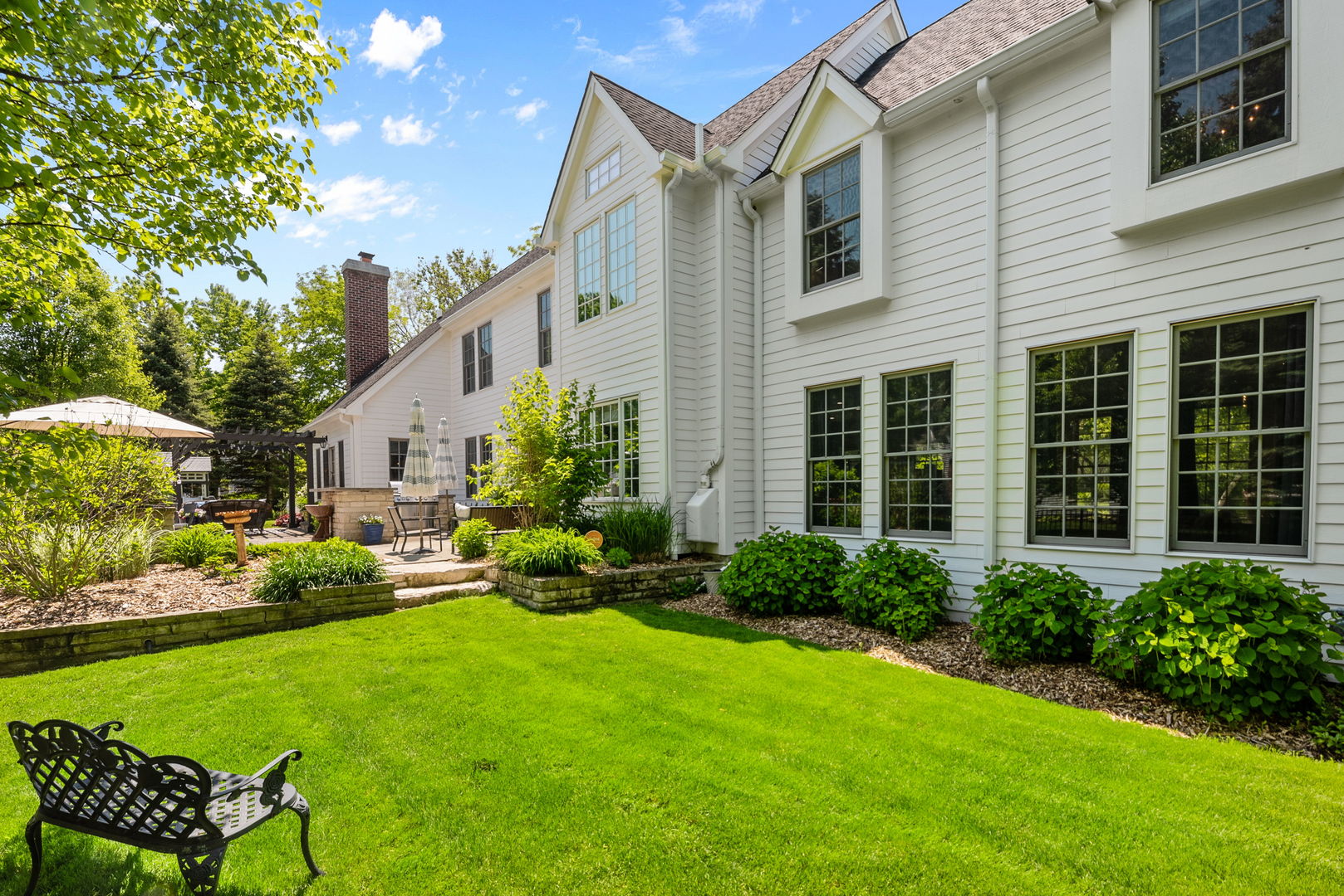 1209 Dunstan Road Geneva, IL 60134 - Photo 26 of 27 a garden view with a seating space