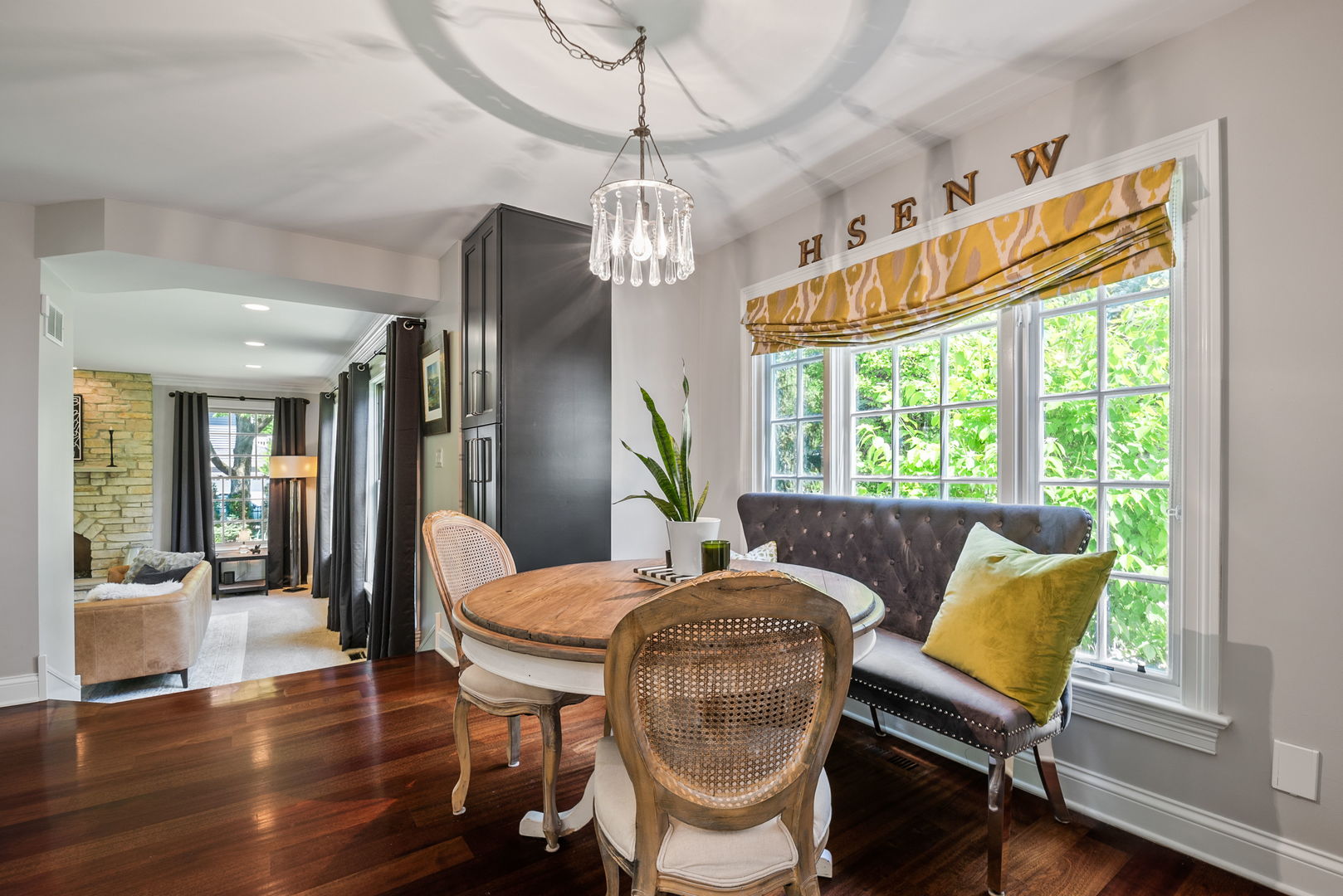 1209 Dunstan Road Geneva, IL 60134 - Photo 5 of 27 a dining room with furniture a chandelier and wooden floor