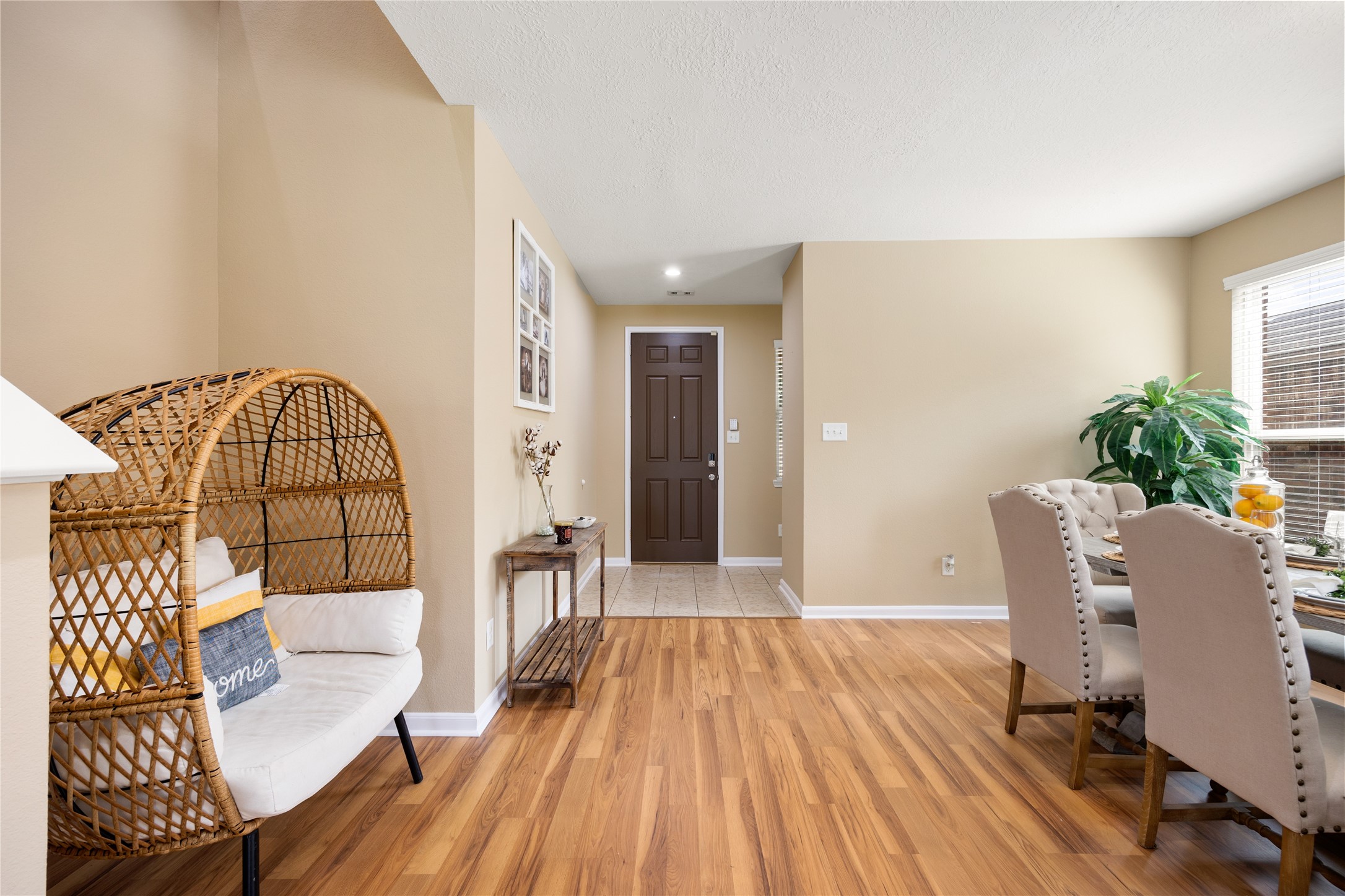 22414 Bellwick Ridge Lane Katy, TX 77449 - Photo 2 of 23 Step into a warm and inviting entry featuring beautiful wood-look flooring, soaring ceilings, and an open layout that creates a welcoming first impression.