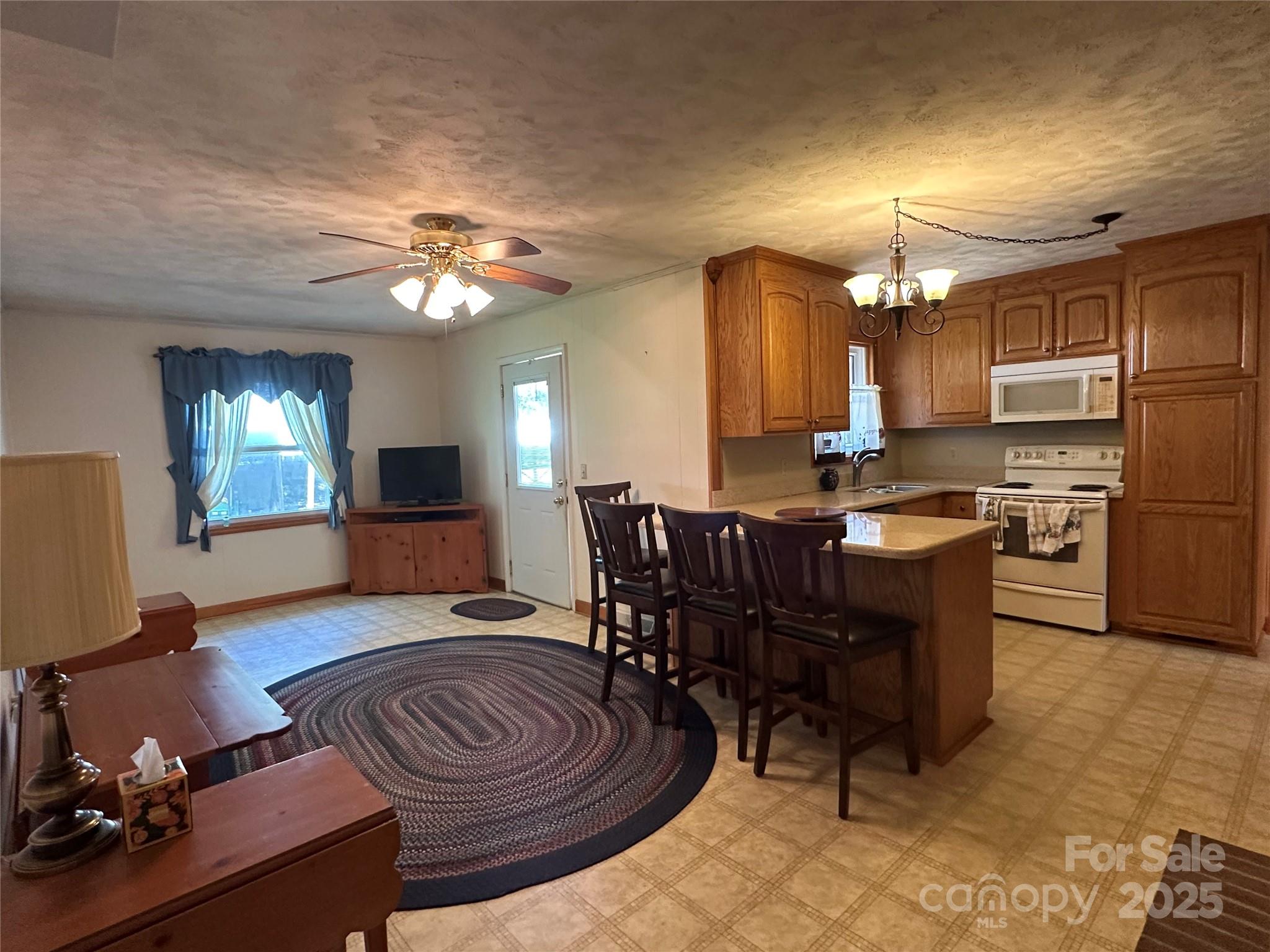 625 Teddar Road Mount Gilead, NC 27306 - Photo 16 of 25 a view of a dining room with furniture