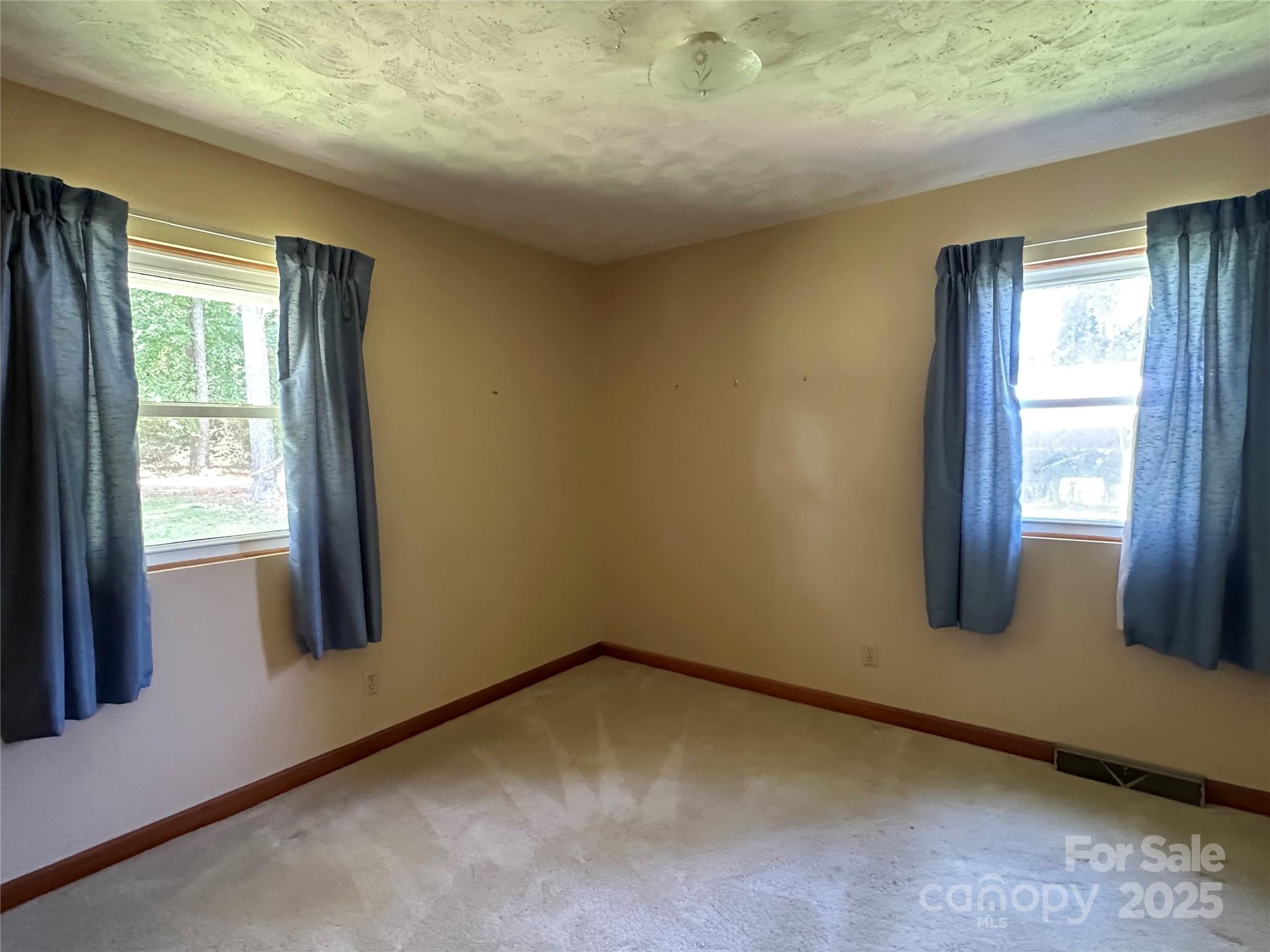 625 Teddar Road Mount Gilead, NC 27306 - Photo 17 of 25 a view of an empty room and window