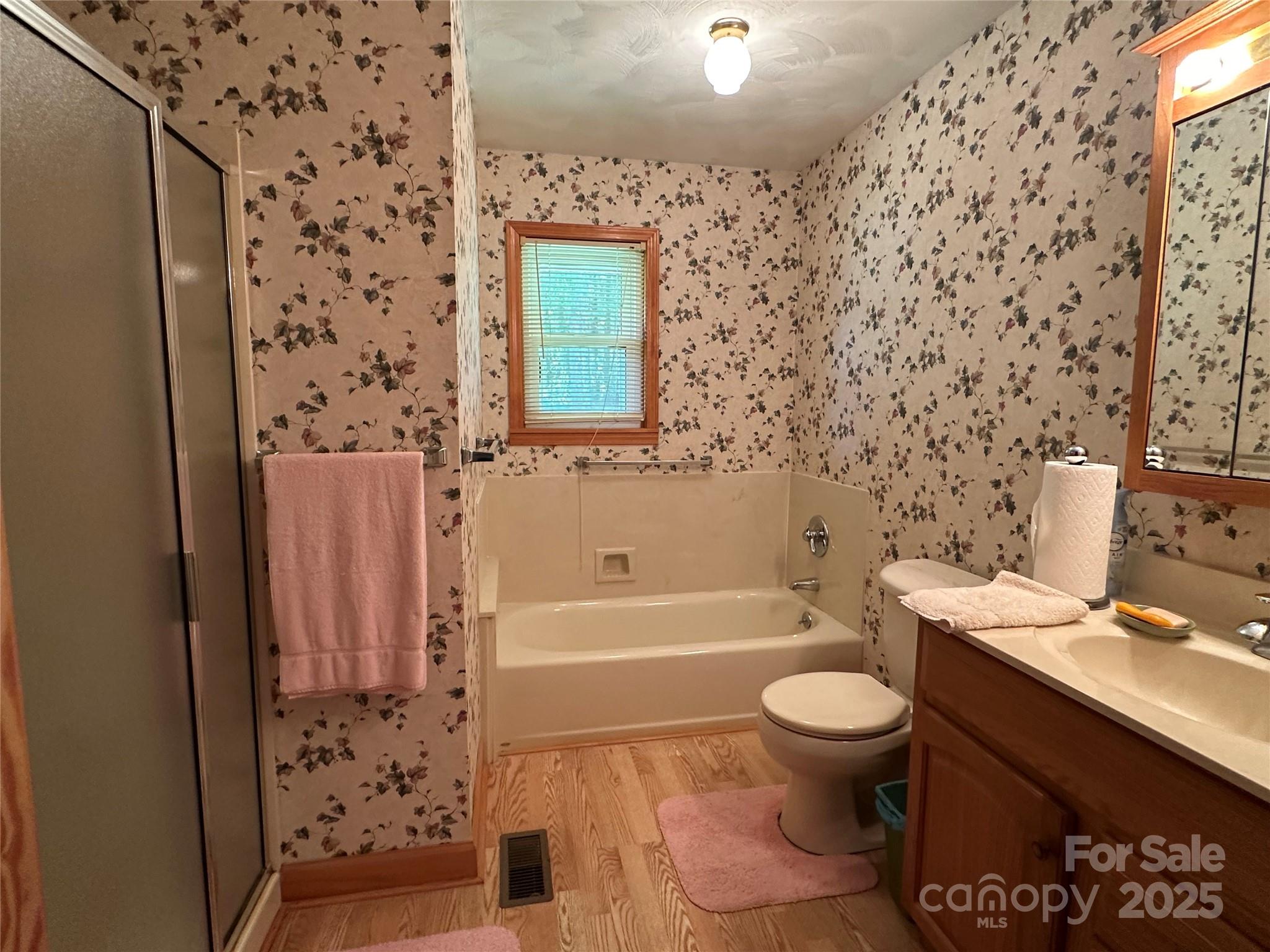 625 Teddar Road Mount Gilead, NC 27306 - Photo 19 of 25 a bathroom with a bathtub sink mirror toilet and shower