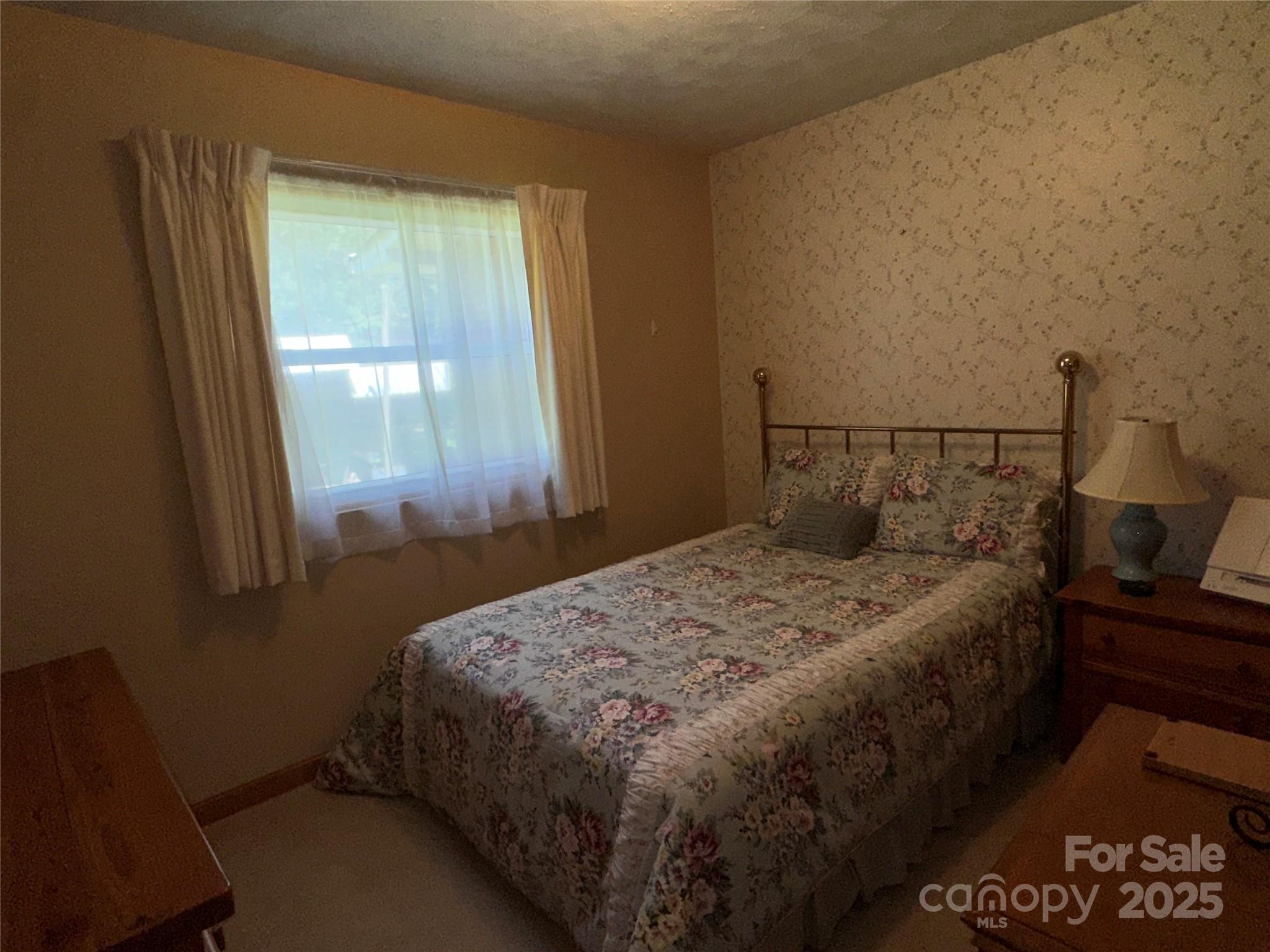 625 Teddar Road Mount Gilead, NC 27306 - Photo 21 of 25 a bedroom with a bed and window