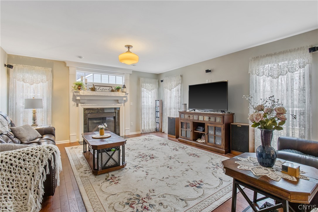 8294 Luchsinger Lane Lysander, NY 13027 - Photo 14 of 47 Cozy FR with lots of natural lighting, gas firepla