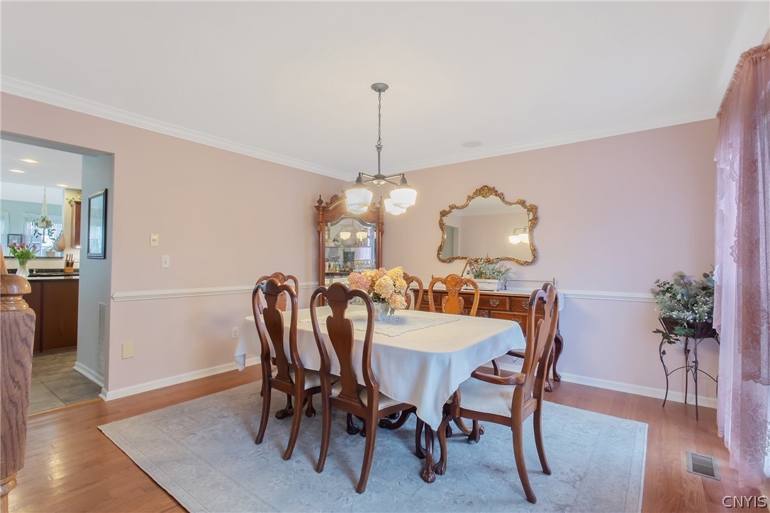 8294 Luchsinger Lane Lysander, NY 13027 - Photo 19 of 47 Spacious Formal DR has hardwood floors and two lar