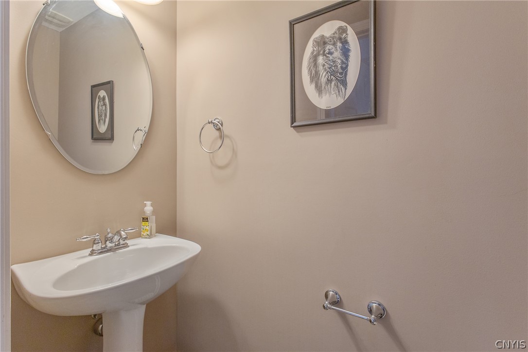 8294 Luchsinger Lane Lysander, NY 13027 - Photo 23 of 47 Half bath with pedestal sink.