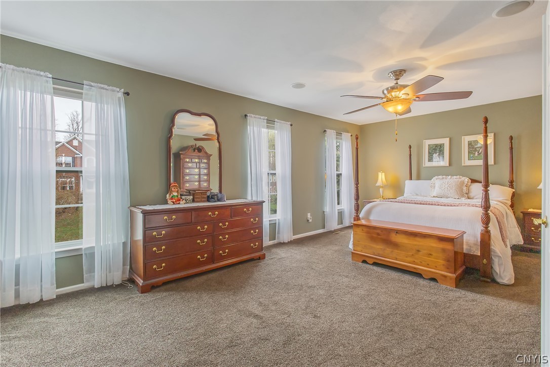 8294 Luchsinger Lane Lysander, NY 13027 - Photo 24 of 47 Oversized Primary BR has double-door entry, carpet