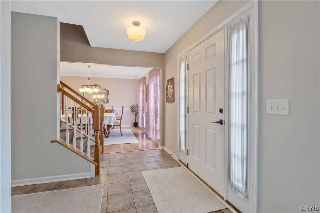 8294 Luchsinger Lane Lysander, NY 13027 - Photo 6 of 47 Wide, spacious center-hall foyer entry with cerami