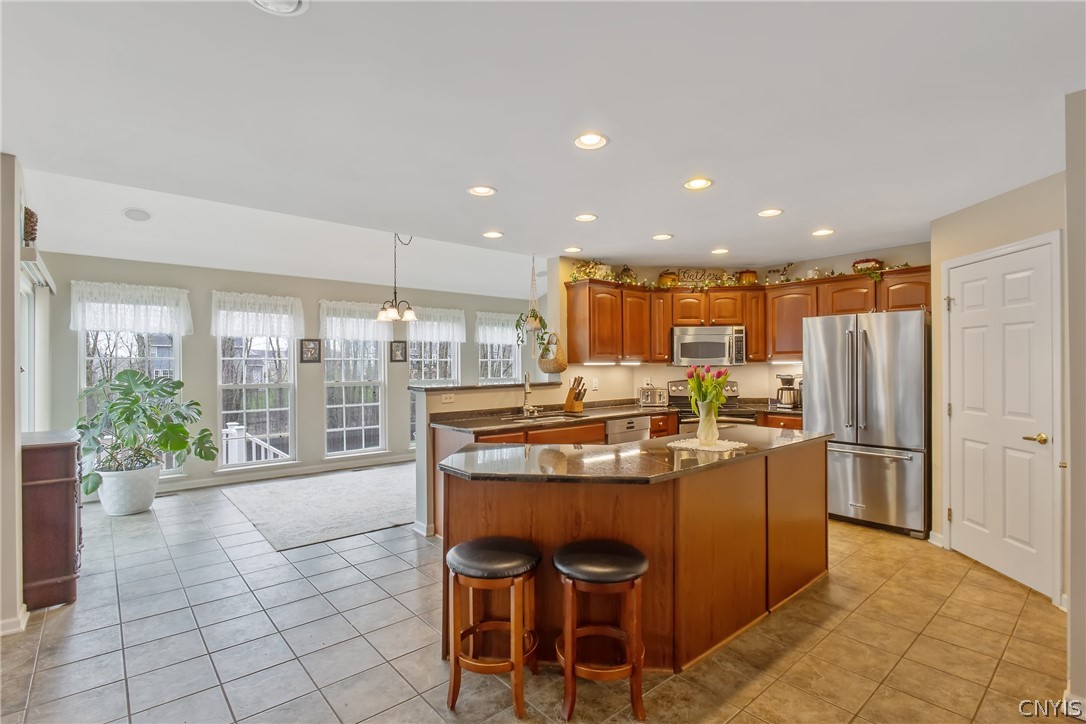 8294 Luchsinger Lane Lysander, NY 13027 - Photo 7 of 47 Gorgeous kitchen with bright morning room, vaulted