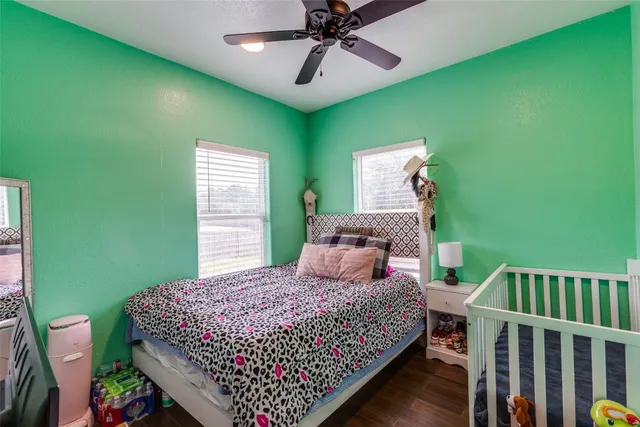 a bathroom with a sink a toilet and shower curtain