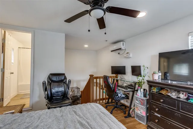 a kitchen with a refrigerator and a stove top oven
