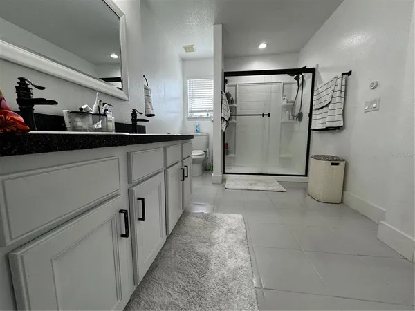 a view of a refrigerator in a kitchen