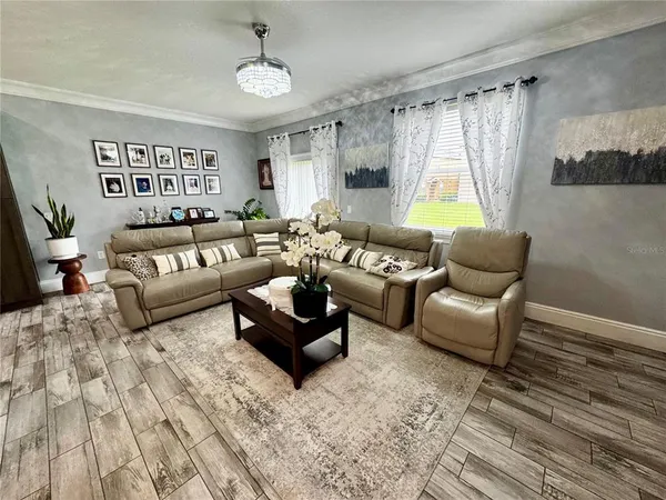 a living room with furniture and a window