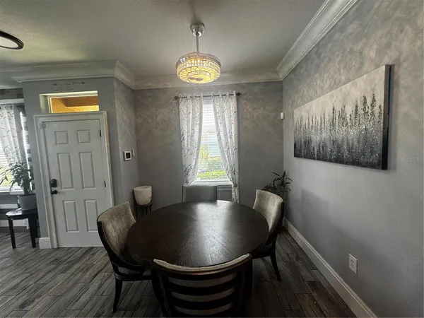 a view of a dining room with furniture and window