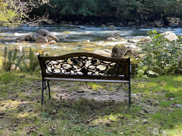 a view of a back yard and a lake view