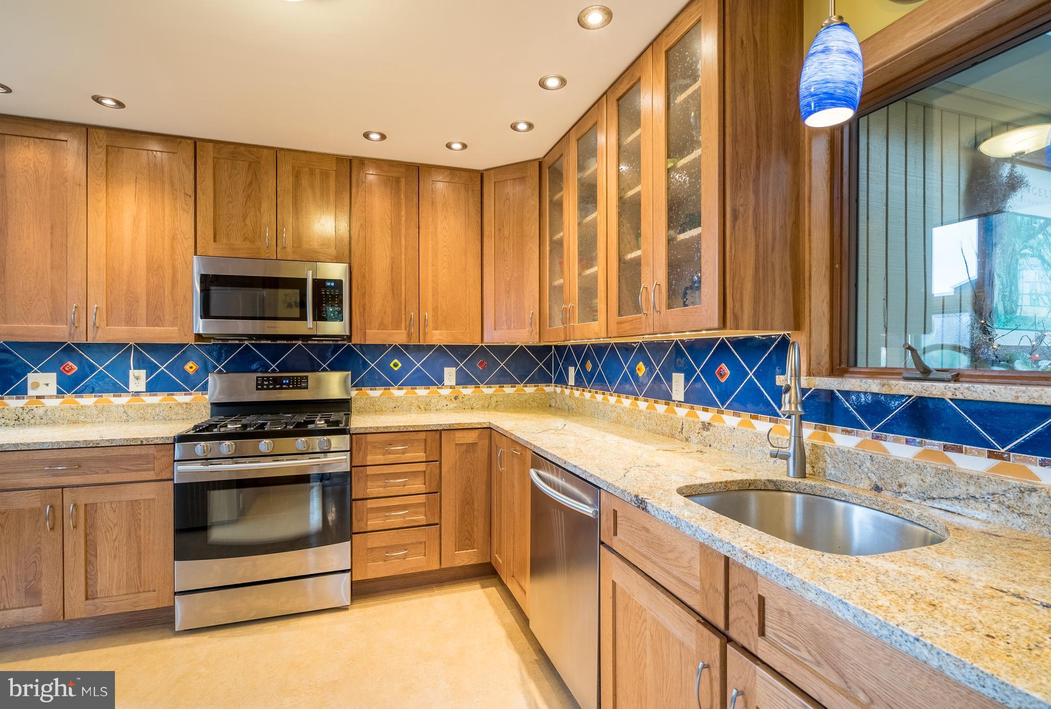 11850 Beaver Dam Road Union Bridge, MD 21791 - Photo 2 of 30 a kitchen with a sink stove and microwave