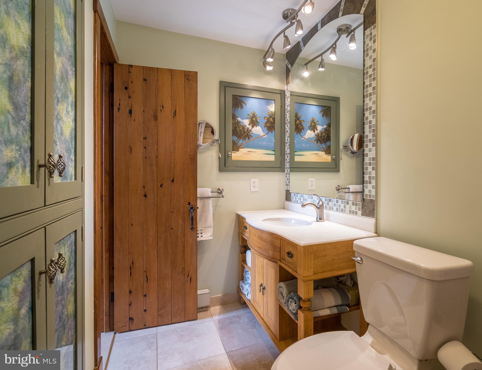 11850 Beaver Dam Road Union Bridge, MD 21791 - Photo 14 of 30 a bathroom with a toilet sink and mirror