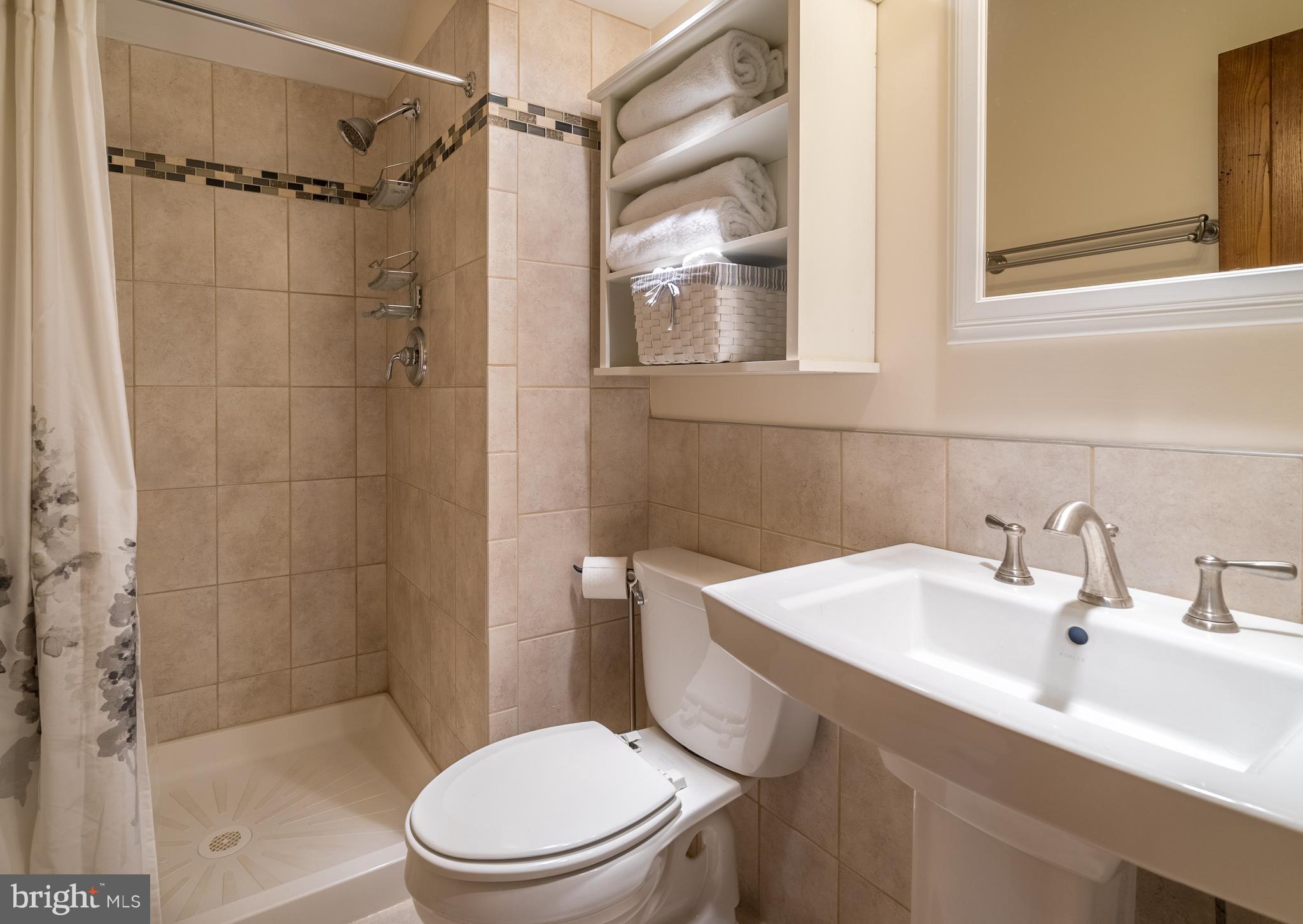 11850 Beaver Dam Road Union Bridge, MD 21791 - Photo 18 of 30 a bathroom with a sink toilet and shower
