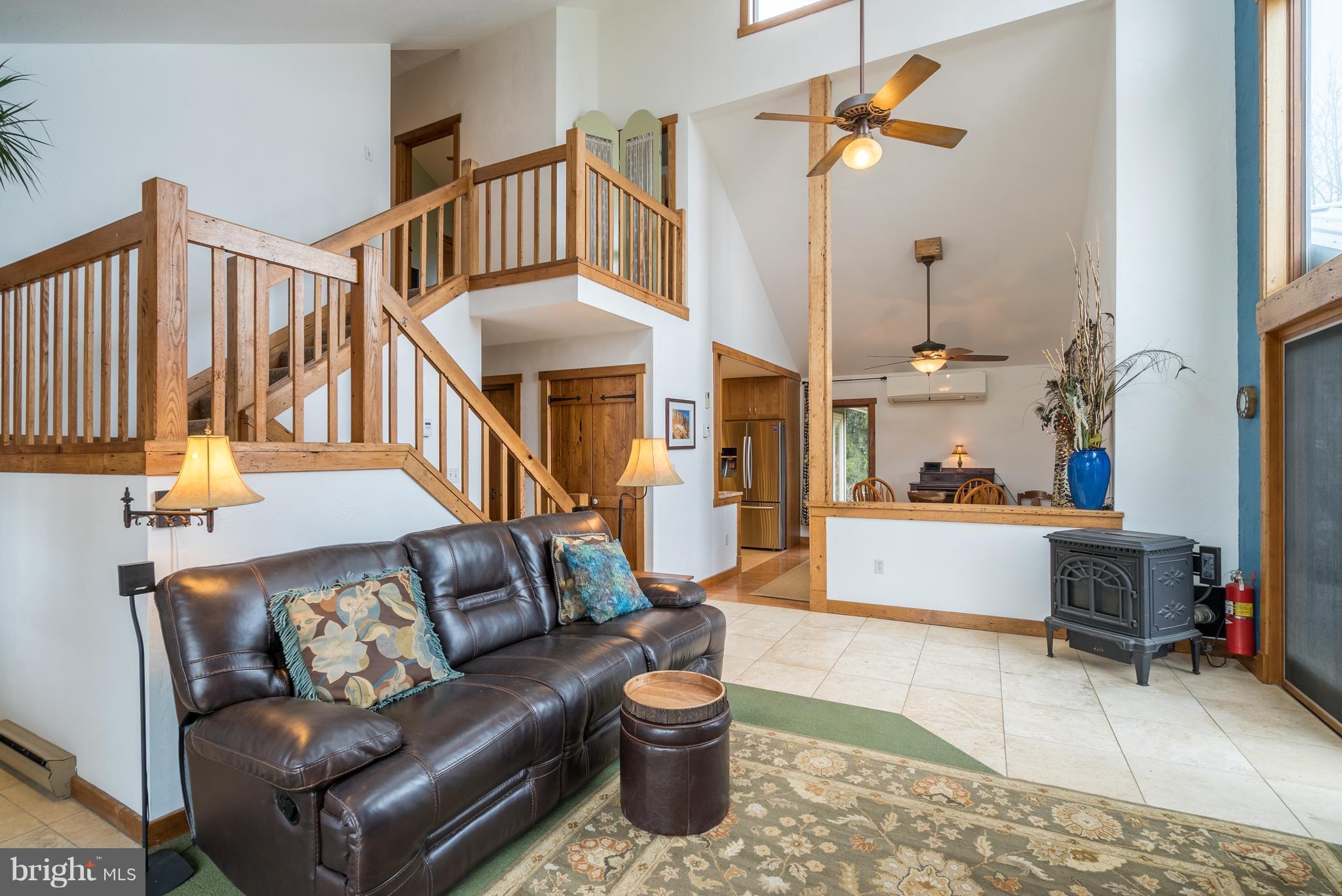 11850 Beaver Dam Road Union Bridge, MD 21791 - Photo 5 of 30 a living room with furniture and a chandelier